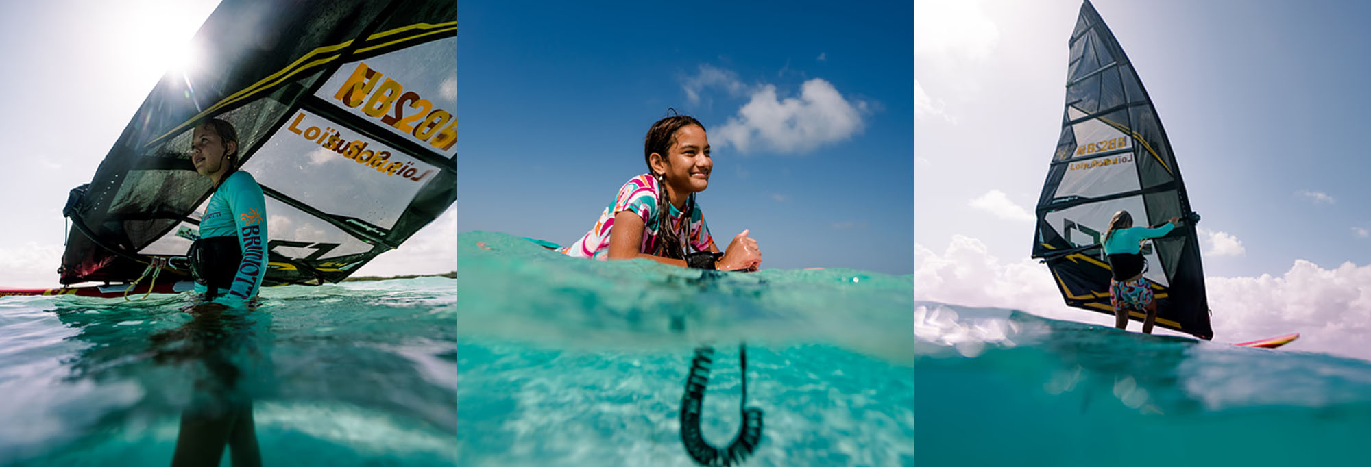 A girl is enjoying her windsurf ride, hanging in the clear water of the sea. She protects herself from the sun by wearing a rashguard from Brunotti.