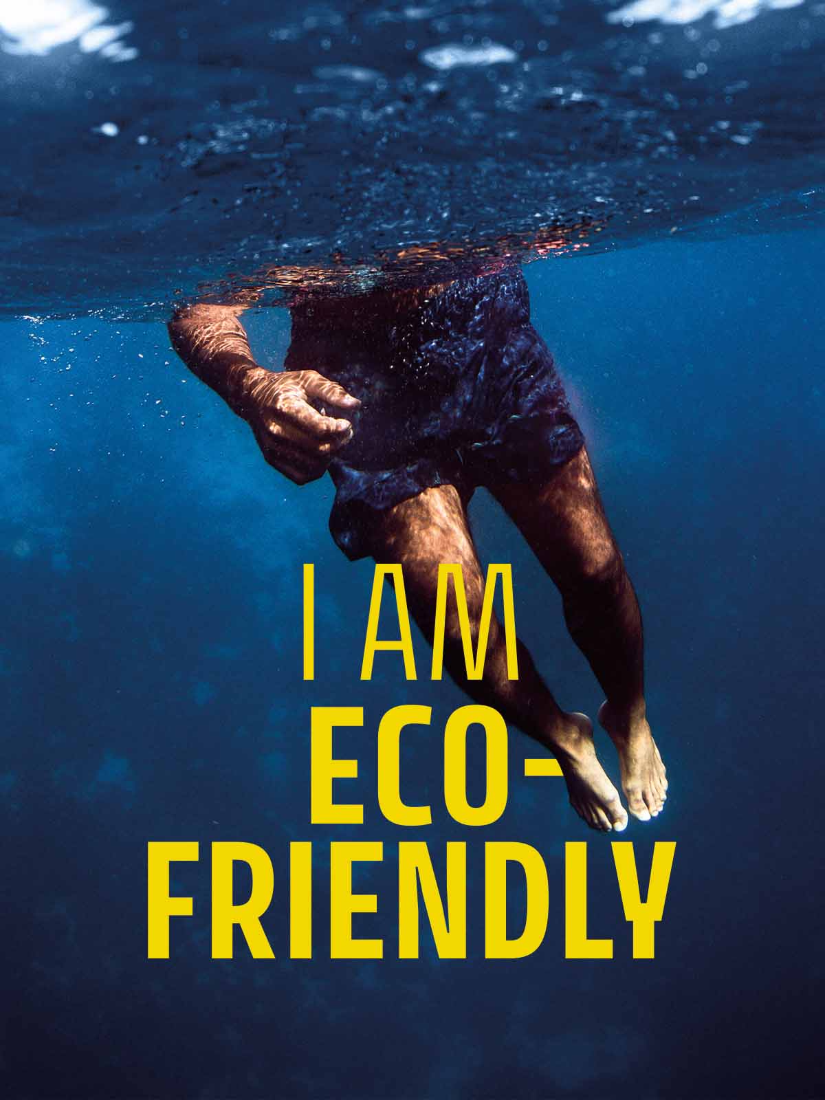 Underwater image showing legs and the dark blue Brunotti Bru-conic Swim Shorts with the words I Am Eco-Friendly in Yellow